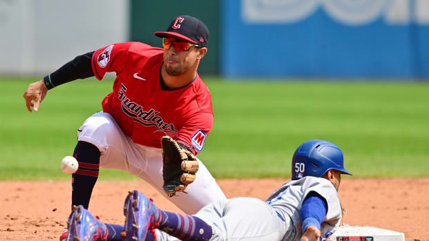 Aug 24, 2023; Cleveland, OH, USA; Cleveland Guardians second baseman Tyler Freeman (2) waist for the ball to tag out Los Angeles Dodgers right fielder Mookie Betts (50) at second base during the fourth inning at Progressive Field. Mandatory Credit: Ken Blaze-USA TODAY Sports